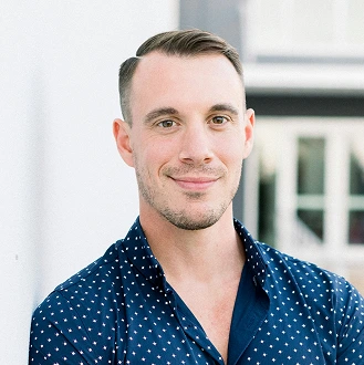 A man in a blue dotted shirt