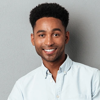 A young man with dark curly hair